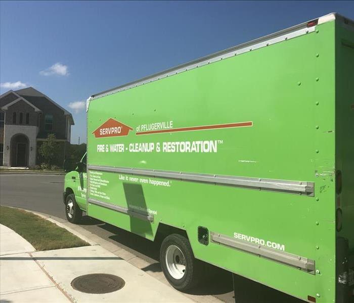SERVPRO of Pflugerville truck outside a residence.