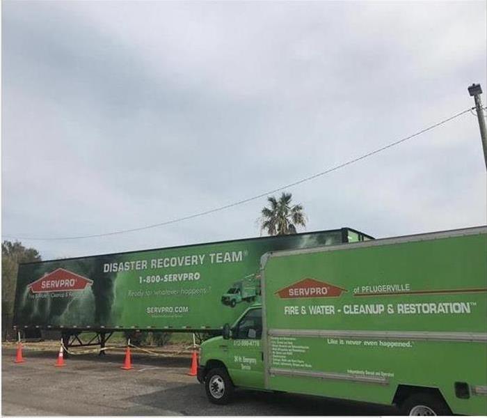 SERVPRO vehicles in parking lot.