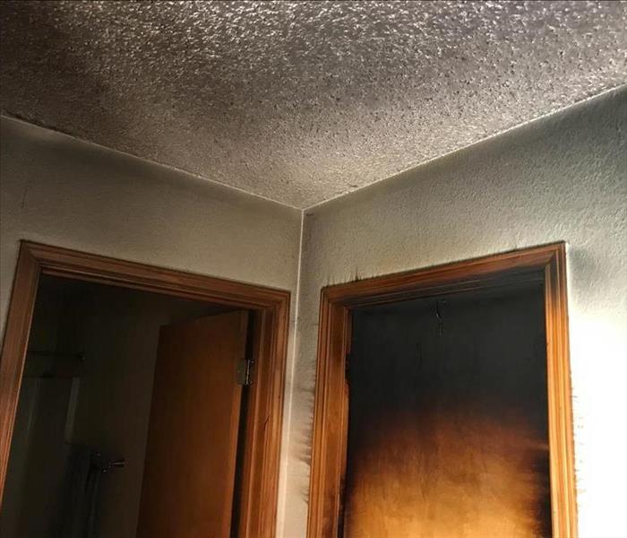 Soot damage on wall and ceilings.